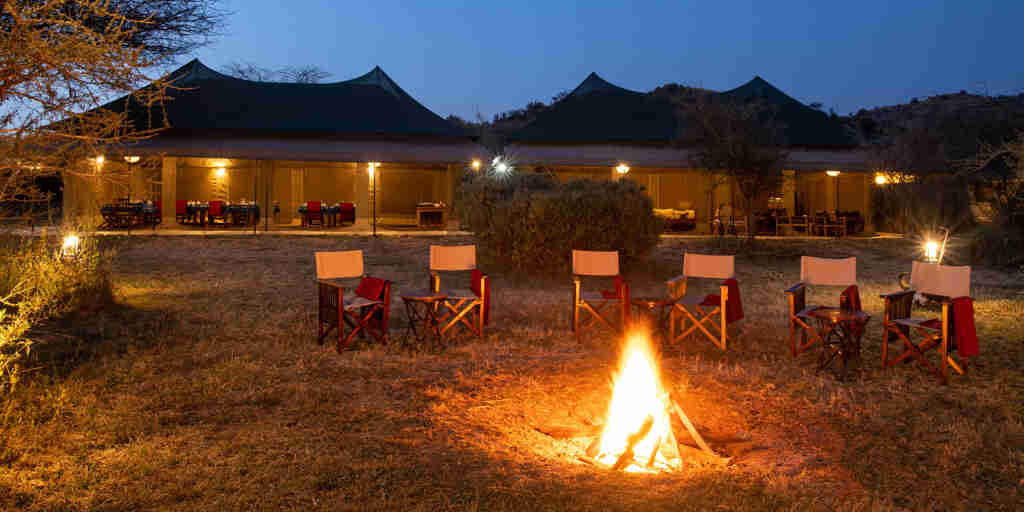 night camp fire, nyikani camp central serengeti, tanzania