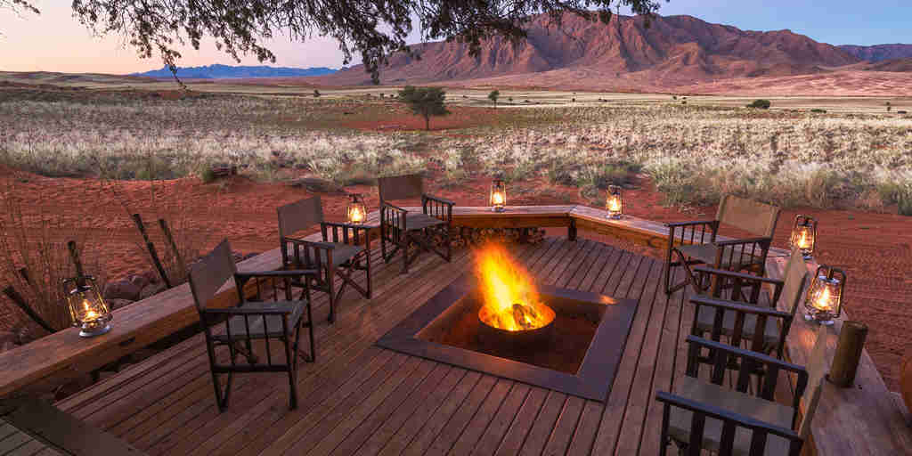 camp fire overlooking the plains, wolwedans dune camp, sossusvlei, namibia