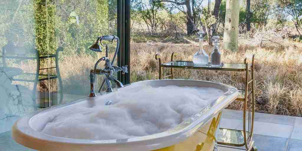 yellow bathtub, waterside at royal malewane, thornybush game reserve, south africa