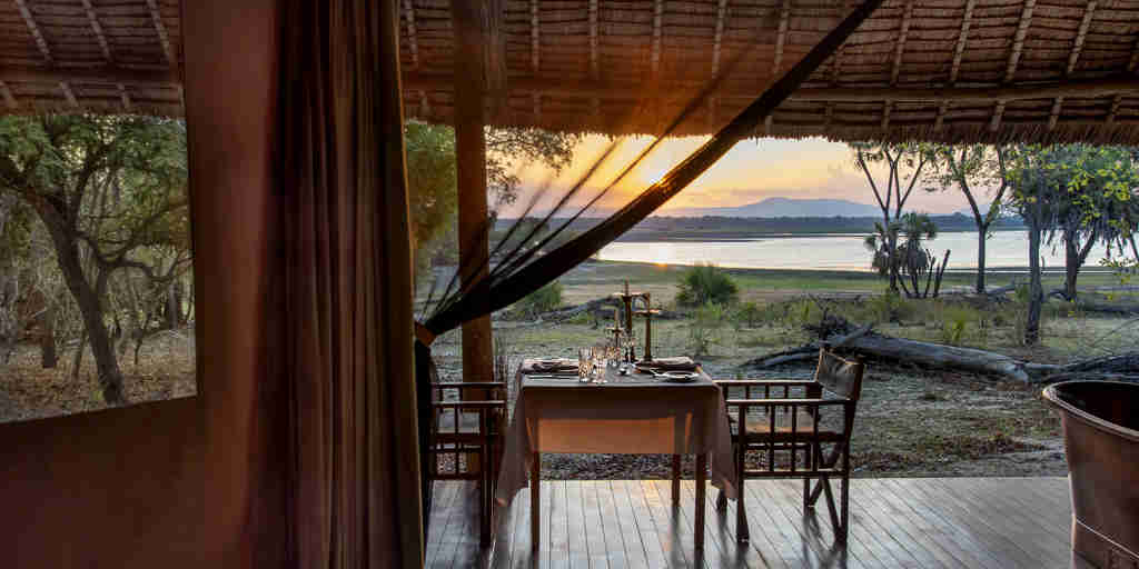 private dinner, siwandu camp, nyerere national park, tanzania
