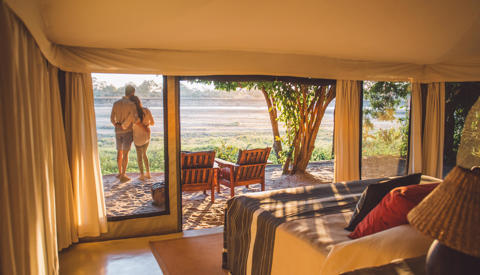 couple in camp, the original south luangwa camps, zambia trips