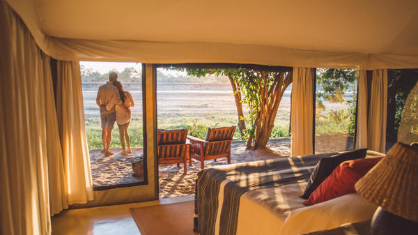 couple in camp, the original south luangwa camps, zambia trips