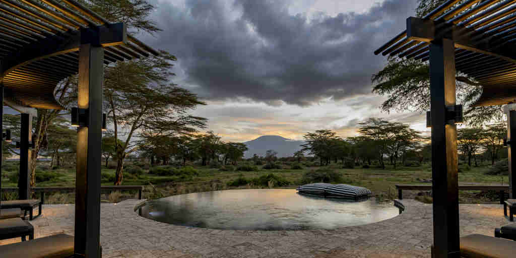 pool at night, angama amboseli, amboseli and the chyyulu hills, kenya
