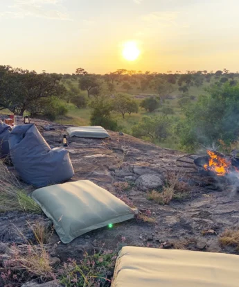 nimili mara camp fire tanzania yellow zebra safaris