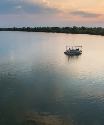 sunset cruise, ila safari lodge, kafue national park, zambia