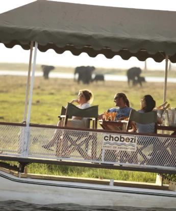 &Beyond Chobe Under Canvas sunset boating