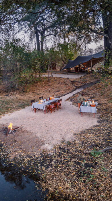 outdoor dining at expedition camp, okavango delta, botswana - Yellow Zebra Safaris