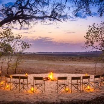 kwara camp fire seating botswana yellow zebra safaris