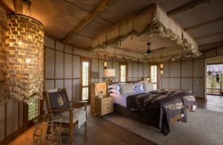 Interior bedroom view on free standing double bed, Mombo, Moremi Game Reserve, Botswana - Yellow Zebra Safari