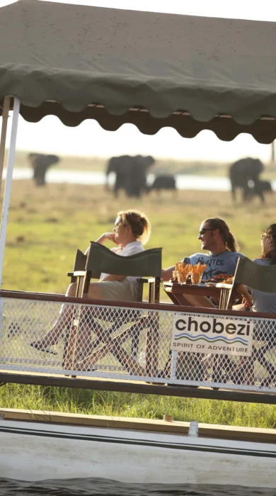 &Beyond Chobe Under Canvas sunset boating
