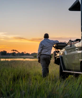 driver and vehicle, 4 rivers, okavango delta, botswana