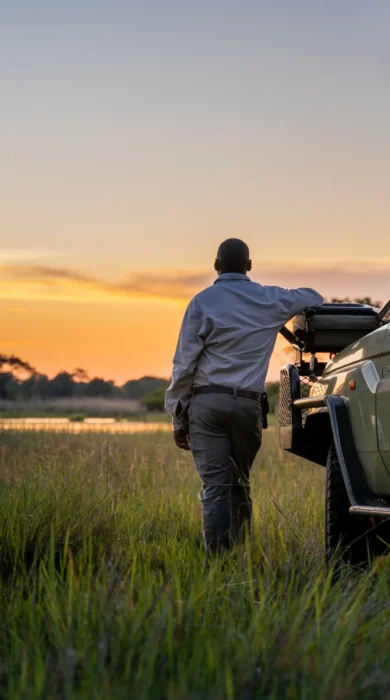 driver and vehicle, 4 rivers, okavango delta, botswana