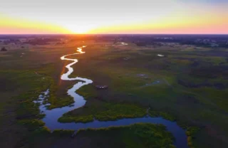 sunset over khwai, botswana safaris, africa vacations
