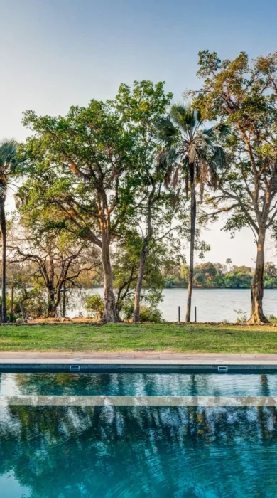 Pool and riverside view, Palm River Lodge, Zimbabwe