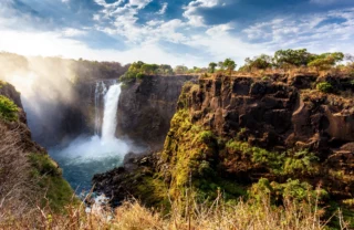 sun beam through victoria falls, zimbabwe safaris