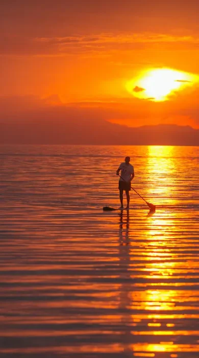 sunset paddle boarding, pumulani lodge, malawi