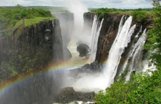 A blurred rainbow on the spray at Victoria Falls - Yellow Zebra Safaris