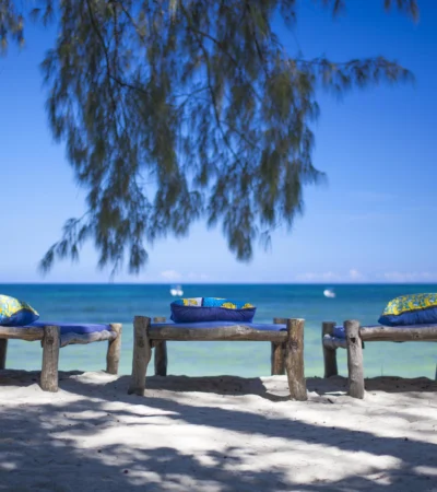deck chairs on diani beach, kenya safaris