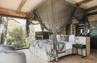 family room bed, vumbura plains, okavango delta, botswana