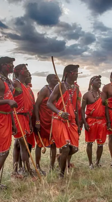 Massai warriors jumping with sunset
