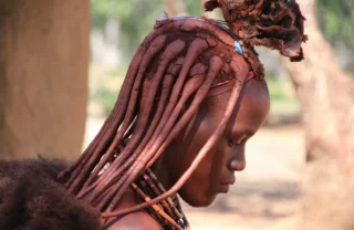 A profile shot of a local woman with braids, Namibia - Yellow Zebra Safaris