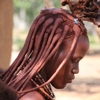 A profile shot of a local woman with braids, Namibia - Yellow Zebra Safaris