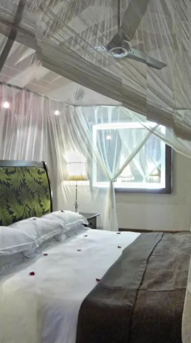 Arusha coffee lodge bedroom tanzania yellow zebra safaris