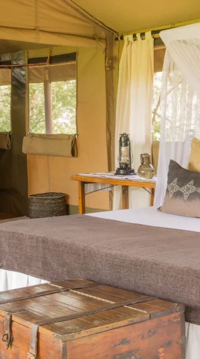 mwiba tented camp tanzania vintage bedroom yellow zebra safaris