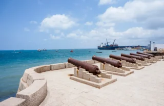 Cannons line the Stone Town waterfront looking out to the ocea, Zanzibar, Tanzania - Yellow Zebra Safaris
