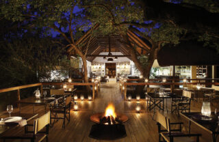 View of the deck at Londolozi Tree Camp in Sabi Sands at night time, Londolozi Tree Camp, Sabi Sands, South Africa - Yellow Zebra Safaris