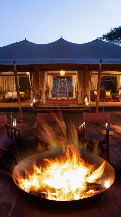 mara nyika kenya camp fire yellow zebra safaris