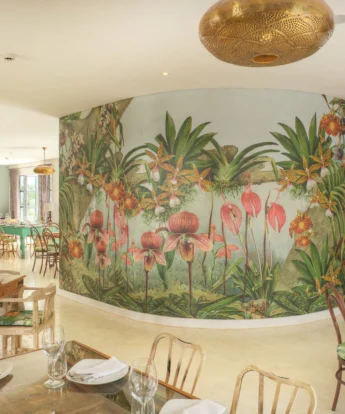 View of the Latitude 0 Degrees dining room featuring flowers painted on the walls, Kampala, Uganda - Yellow Zebra Safaris