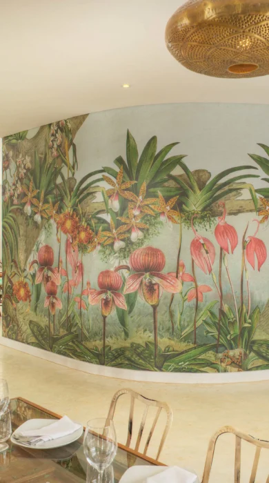 View of the Latitude 0 Degrees dining room featuring flowers painted on the walls, Kampala, Uganda - Yellow Zebra Safaris