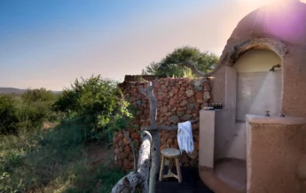 madikwe kopano lodge south africa shower yellow zebra safaris